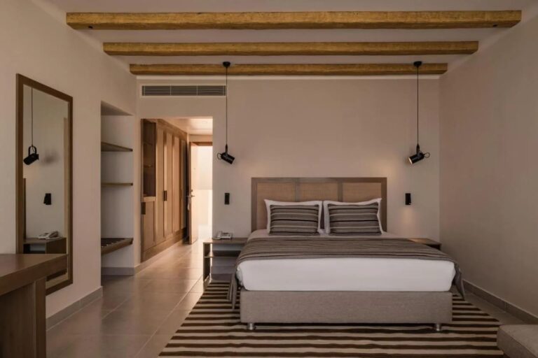 A double room under an exposed-beam ceiling