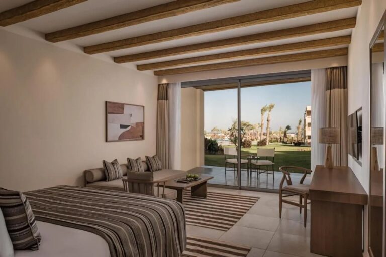 A room opening onto a terrace and the garden, with a sitting area