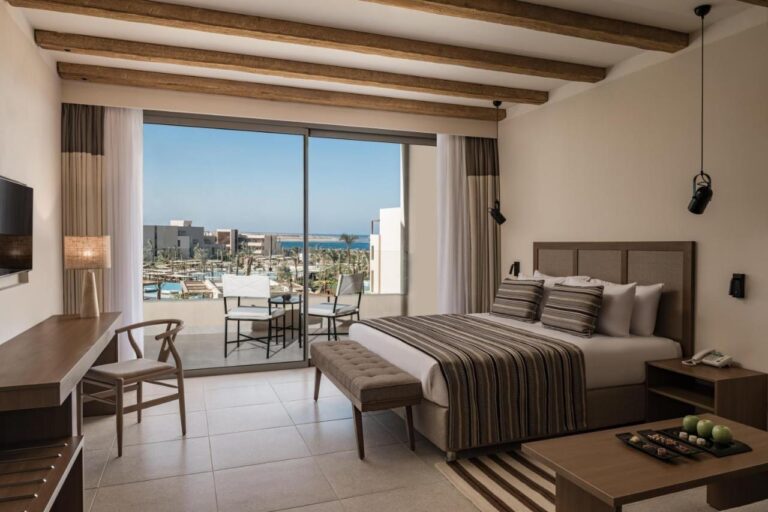 A double room with a balcony, overlooking the pools and the Red Sea