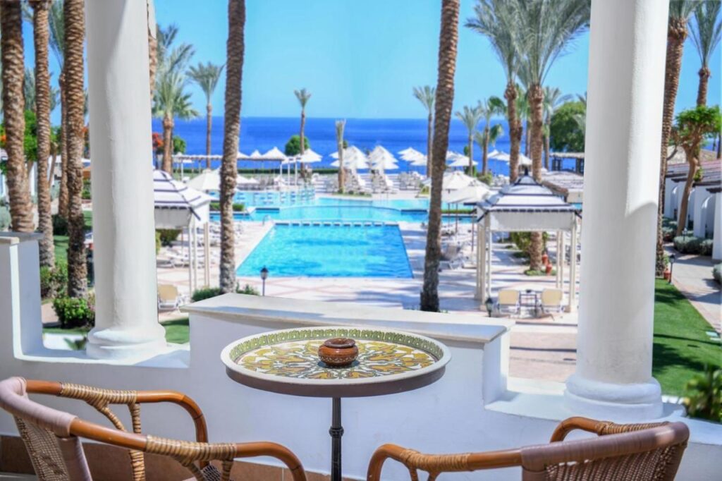 The view from a terrace at JAZ Fanara Resort over the pools, the palm trees and the Red Sea