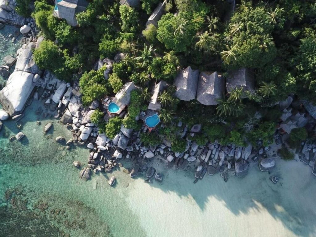 Aerial view of Koh Tao Cabana, its cottages among the trees, its rocks and its white sand beach