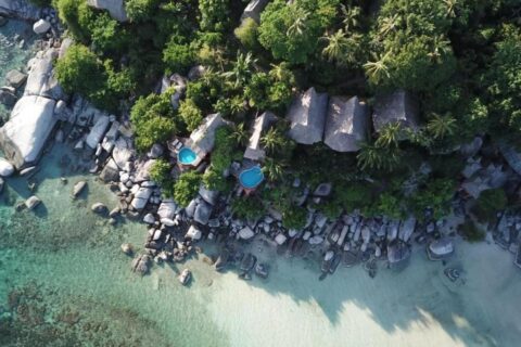 Aerial view of Koh Tao Cabana, its cottages among the trees, its rocks and its white sand beach