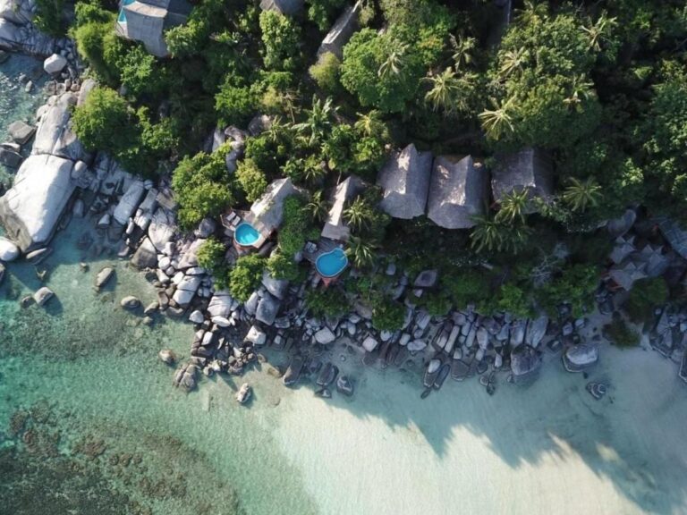 Aerial view of Koh Tao Cabana, its cottages among the trees, its rocks and its white sand beach