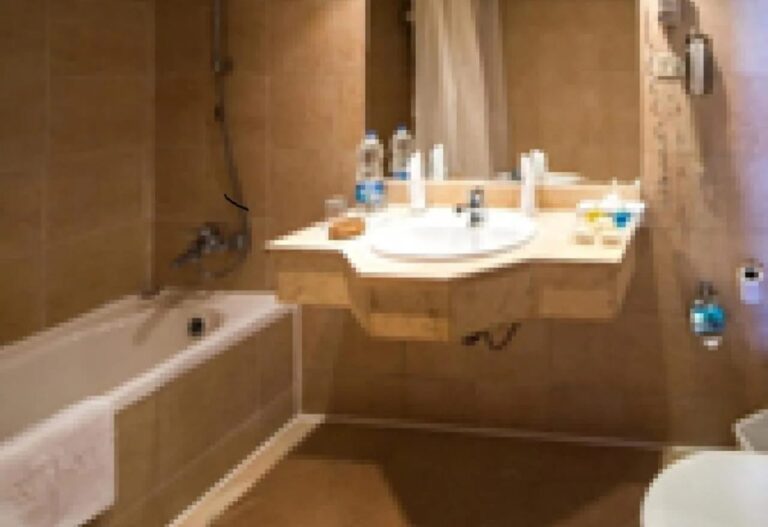 A bathroom with a bathtub and a built-in sink