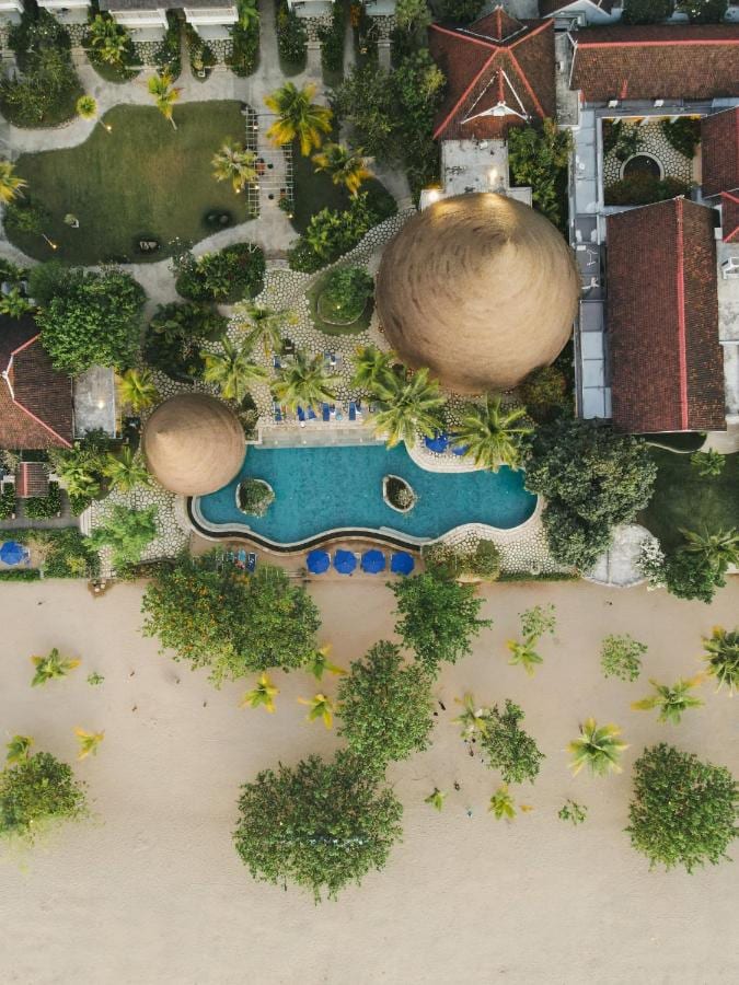 Aerial view of Sudamala Resort Komodo, its pool, its gardens and its beach