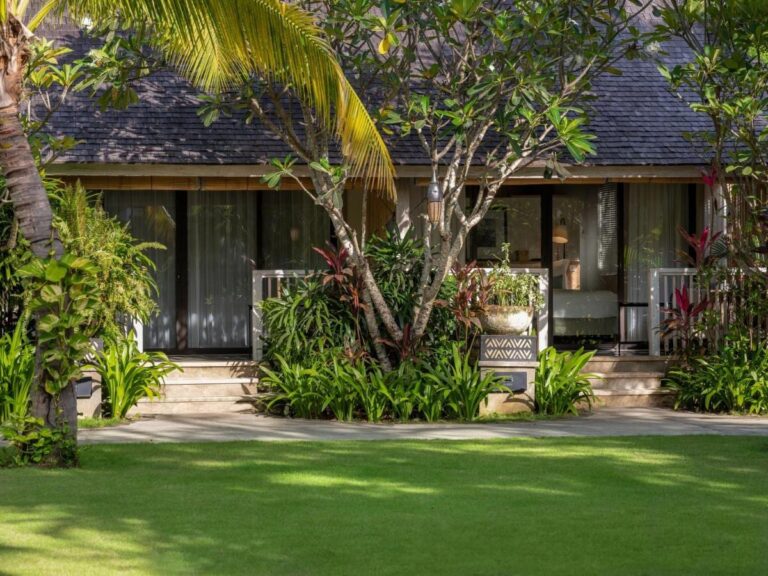 Bungalows at Sudamala Resort Komodo on the edge of a lawn